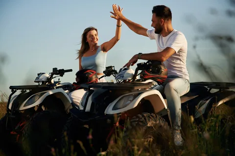 Couple riding a quad bike in Kavos, Corfu — Beach Rentals